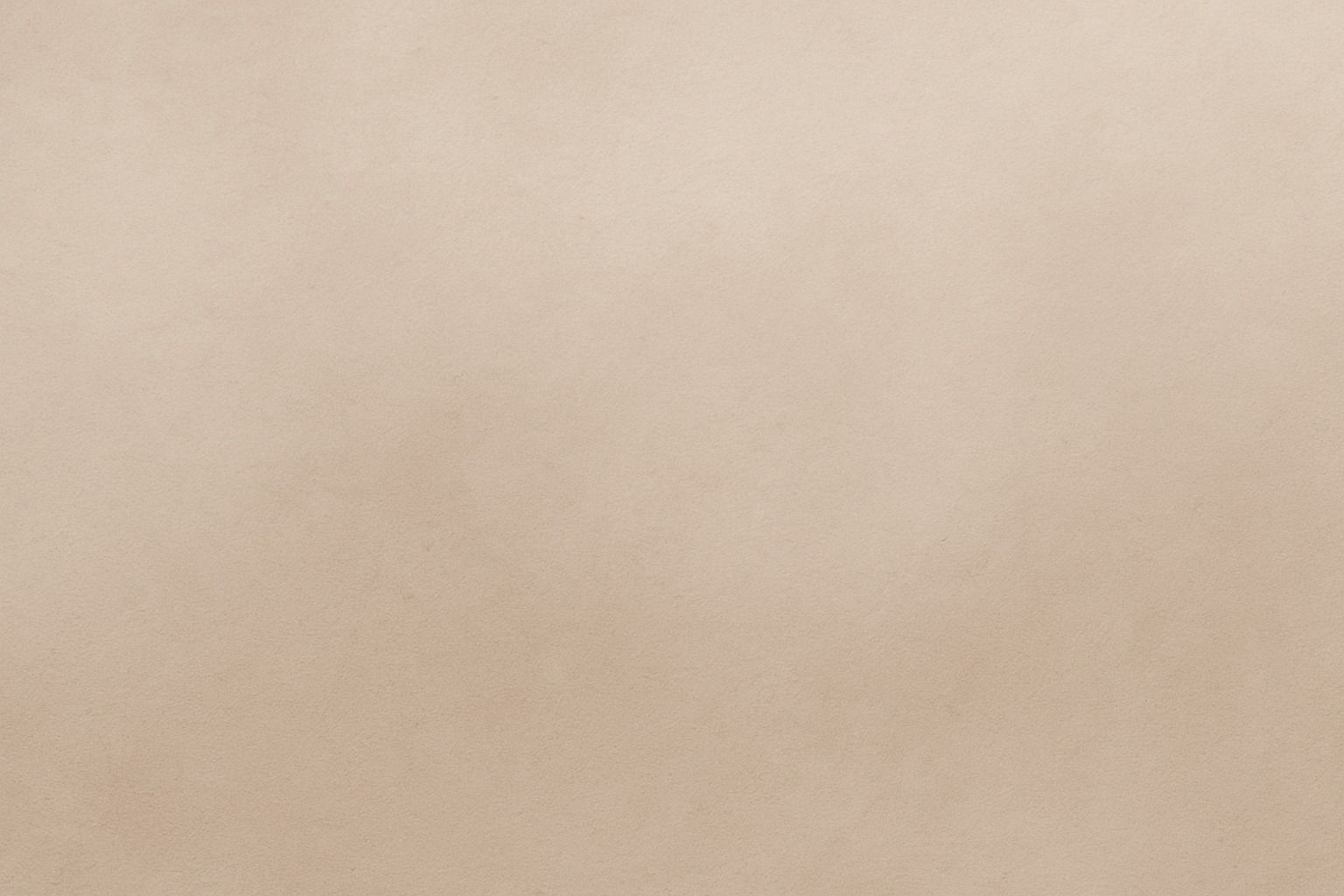 Smooth beige textured surface background.