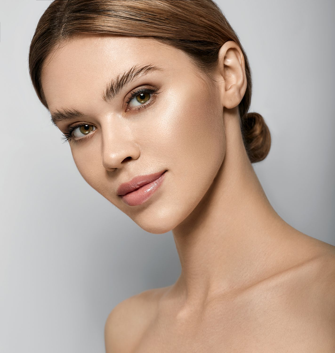 Woman with natural beauty in a serene pose.