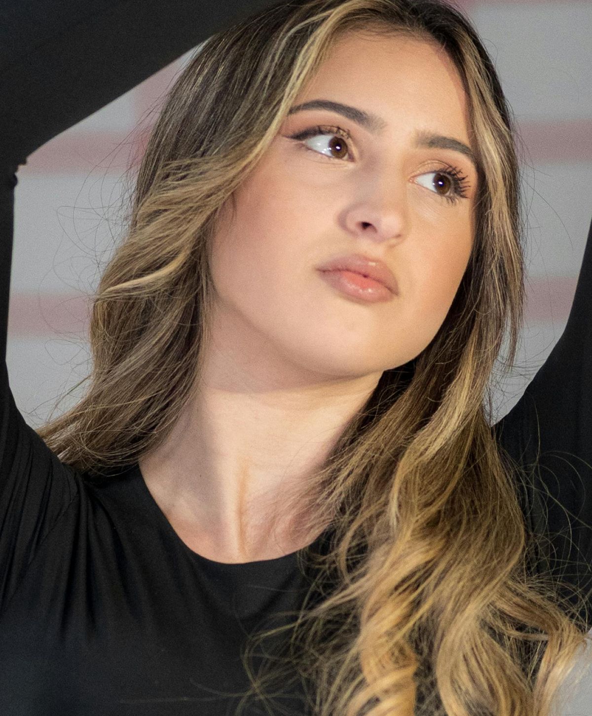 Portrait of a young woman with long hair.
