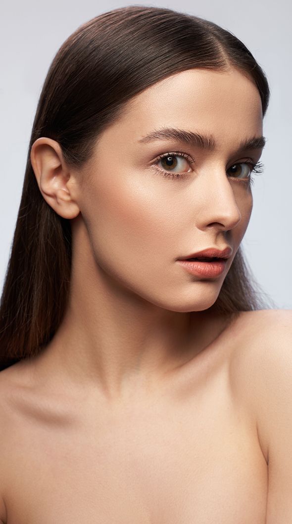 Profile of a woman with natural makeup.