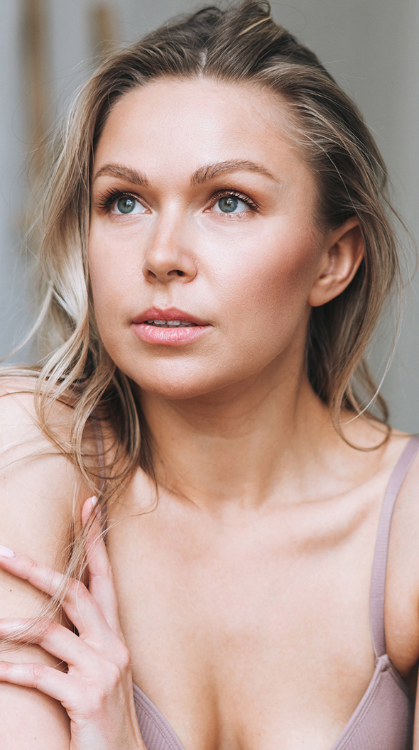 Woman with long hair, soft gaze and expression.