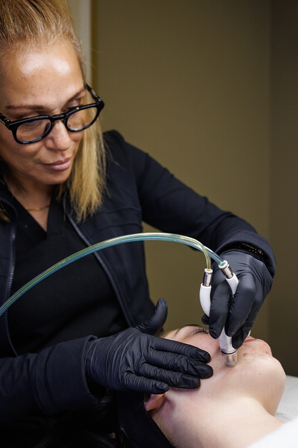 Smiling woman with long, wavy hair.