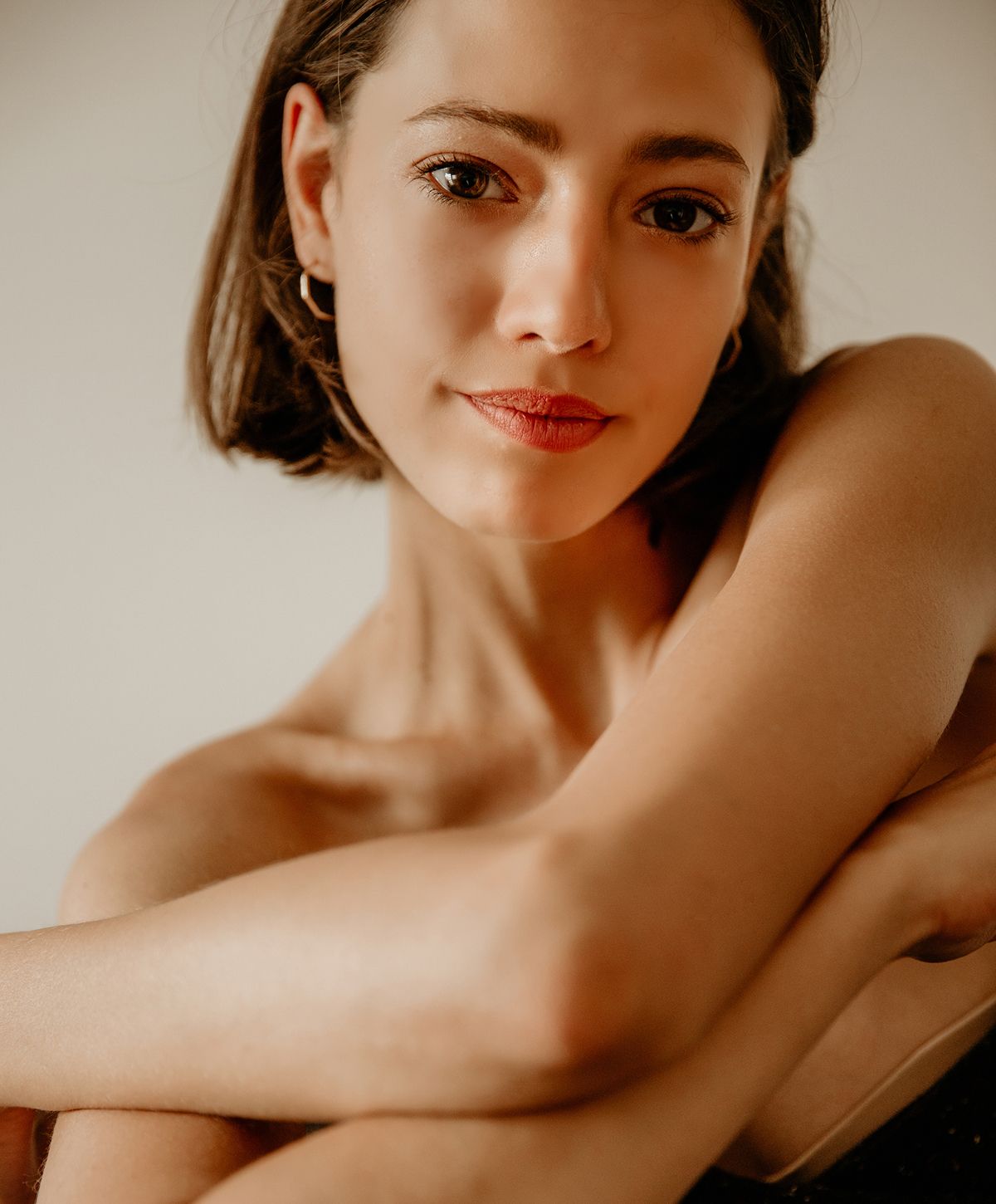 Female portrait with softly lit facial features.