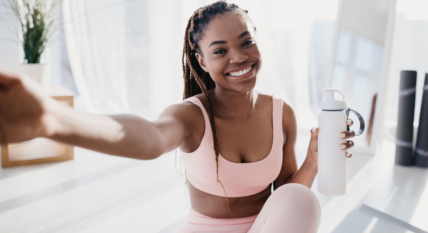 Smiling woman in professional attire indoors.